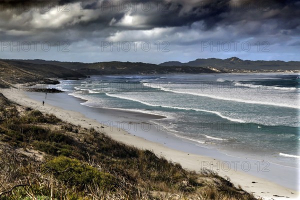 Wide coastal landscape with rough waves and cloudy sky near Vivonne Bay, Vivonne Bay, Kangaroo Island, Australia