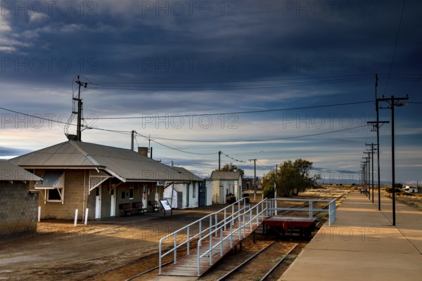 Abandoned train station in Marree with secluded tracks and dramatic skies, Marree, South Australia, Australia