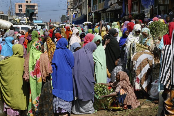 Busy market with people wearing colorful clothes, Khat trade, Awaday, Ethiopia