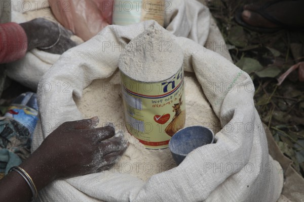 Market scene in Awaday with flour in a sack and khat in the background, Awaday, Ethiopia