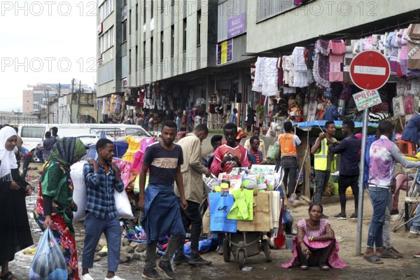 Diverse market life on the Mercato in Addis Ababa with colorful clothes and stalls, Addis Ababa, null, Ethiopia