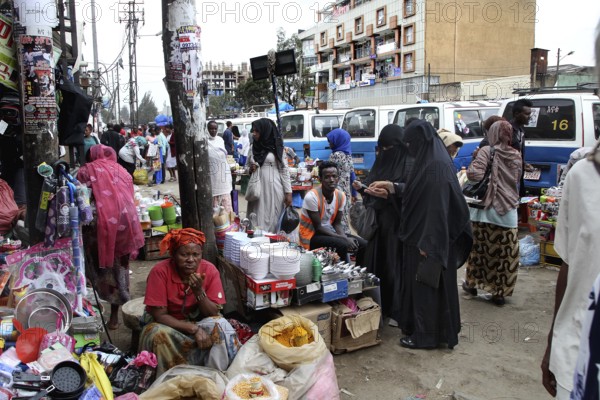 Grocery store on a busy street with woman wearing hijab, Addis Ababa, Mercato, Ethiopia