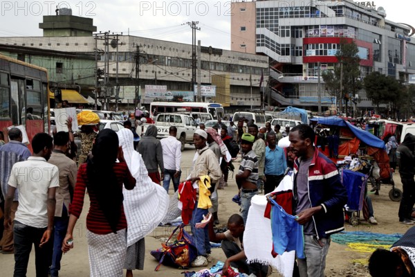 Bustling market area with lots of people and an urban backdrop, Addis Ababa, Mercato, Ethiopia