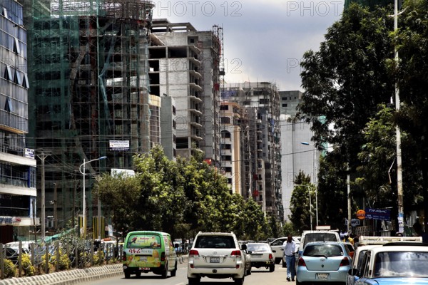 Urban street with trees flanked by modern buildings, Addis Ababa, Ethiopia