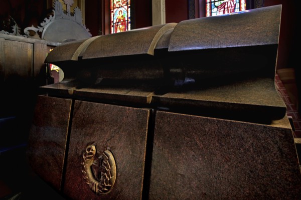 The sarcophagus of Emperor Haile Selassie in the Trinity Church of Addis Ababa surrounded by colorful glass window light, Addis Ababa, null, Ethiopia