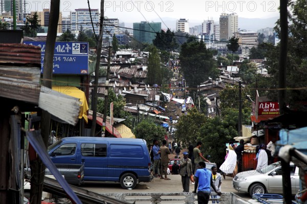 Busy street view in the Mercato of Addis Ababa with people and vehicles, Addis Ababa, Ethiopia