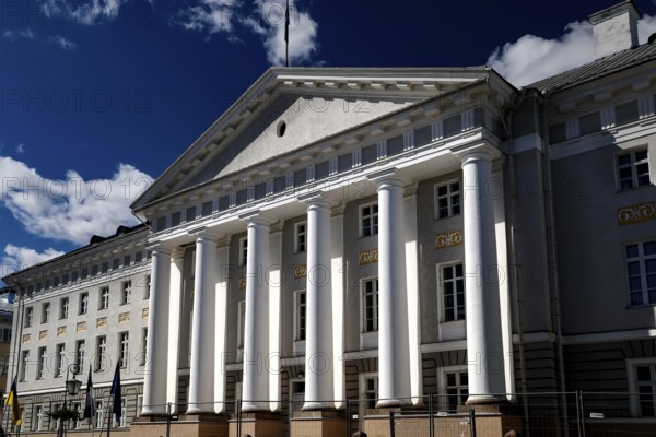 Impressive university with pillars in the old town of Tartu under a blue sky, Tartu, Estonia