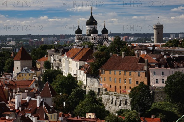 View of St. Olaf's Church and Cathedral Hill in Tallinn with historic buildings under a cloudy sky, Tallinn, Harju, Estonia