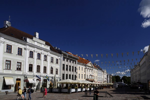 Panorama of buildings along Town Hall Square, Rathausplatz, Rathausplatz in Tartu under a bright blue sky, Tartu, Estonia
