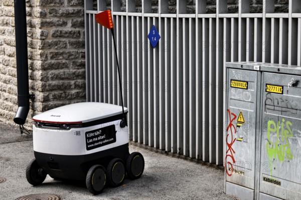 Small delivery robot on a paved road in Tallinn, Tallinn, Kelmiküla, Estonia