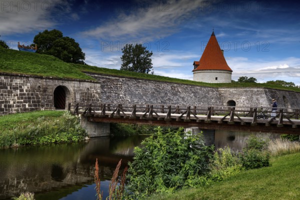 Medieval castle with bridge and moat surrounded by green countryside, Kuressaare, Saaremaa, Estonia