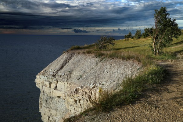Dramatic cliffs of Panga overlooking the sea under an impressive sky, Panga, Saaremaa, Estonia