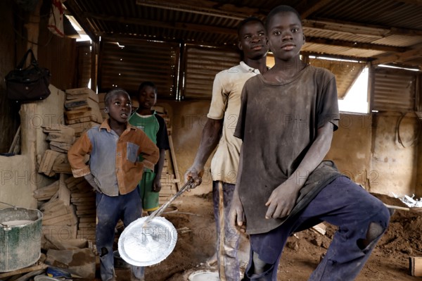 Young pot makers in their workshop showing the craft process, Korhogo, CI, West Africa