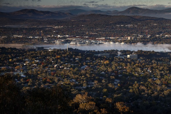 Panoramic view from Mount Ainslie of Canberra's western suburbs and countryside at dusk, Canberra, Australian Capital Territory, Australia
