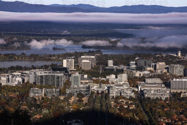 Overview of Mount Ainslie Lookout on Canberra amid surrounding mountains and morning light, Canberra, Australian Capital Territory, Australia