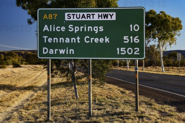 Sign showing distances to Alice Springs and Darwin on Stuart Hwy, Alice Springs, Australia