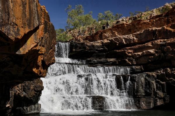 Impressive waterfall in Bell Gorge that flows over several rock steps, Bell Gorge, Australia
