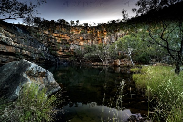 Adcock Gorge with reflecting water and lush vegetation at dusk, Adcock Gorge, Western Australia, Australia