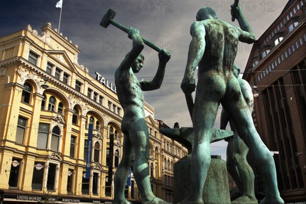 Monument to the Three Blacksmiths at the corner of Pohjoisesplanadi and Mannerheiminti in Helsinki, Helsinki, Uusimaa, Finland