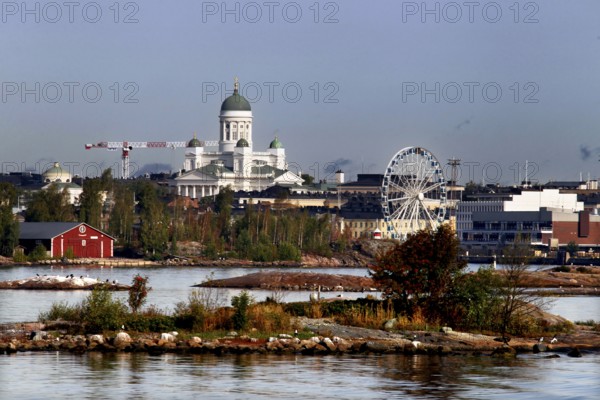 A view of Helsinki with cathedral and Ferris wheel behind an island offers a fascinating panorama, Helsinki, Finland