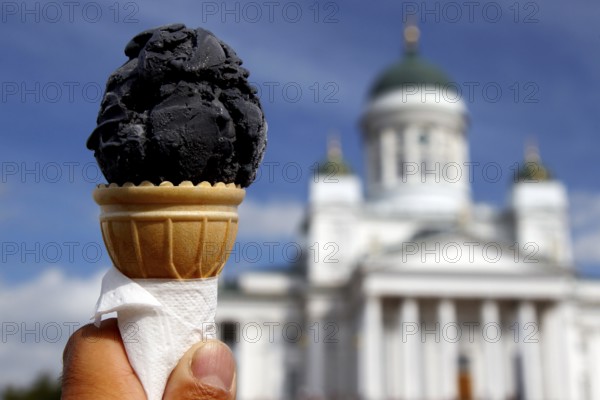 Salmiak ice cream in front of Helsinki Cathedral on Senaatintori Square, Helsinki, Finland, Finland