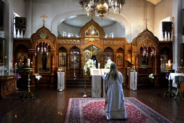Interior view of Uusi Valamo monastery in Heinävesi during a church service with an impressive iconostasis, Heinävesi, Finland