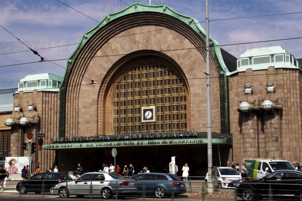 Helsinki's main station portal, a mix of historic architecture and bustling city life, Helsinki, Finland
