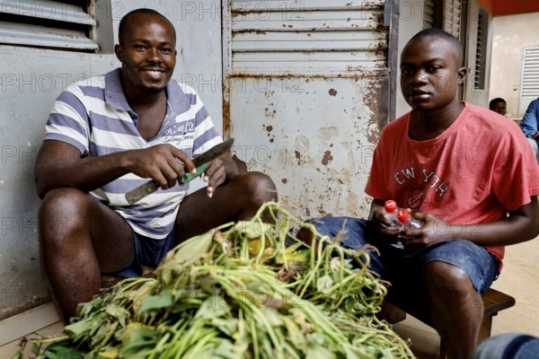 Men work together in the kitchen of Saint Camille men's psychiatry, Bouaké, Côte d'Ivoire
