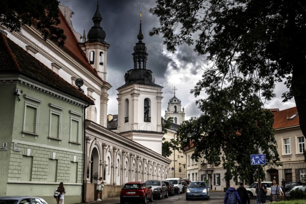 Street in Vilnius with a view of a monumental church and dramatic sky, Vilnius, Vilnius County, Lithuania