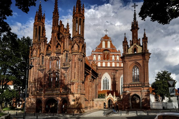 Two Gothic churches with distinctive towers and brick structure in Vilnius, Vilnius, Lithuania