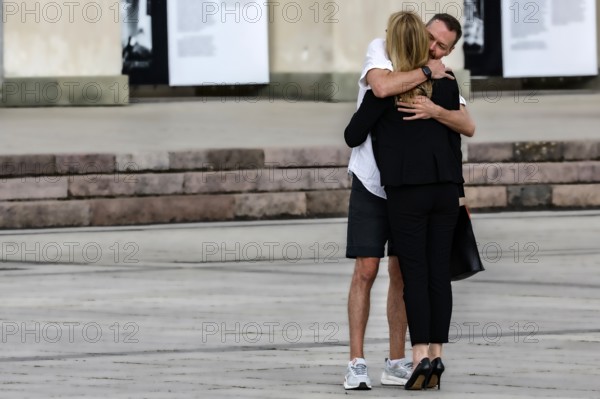 Couple hugging warmly on Cathedral Square in the open air, Vilnius, Vilnius County, Lithuania