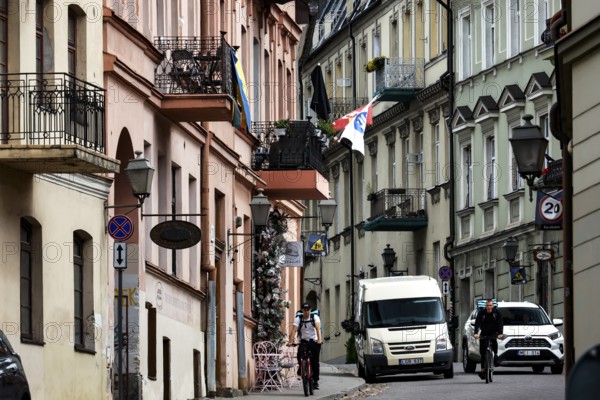 Busy street with cars and flags in the artistic district of Vilnius' Užupis, Vilnius, Užupis, Lithuania