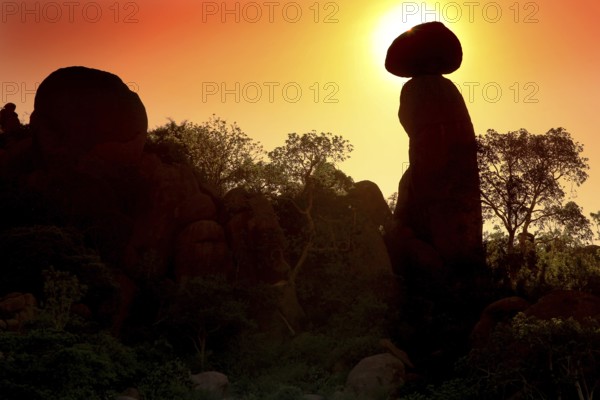 Silhouettes of rocks and trees during a spectacular sunrise in the Valley of Wonders, Babile, Oromia, Ethiopia