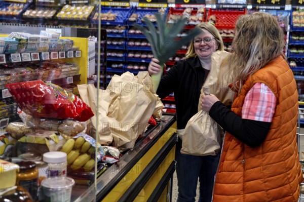 Two people shopping in a supermarket in Christchurch, Christchurch, New Zealand