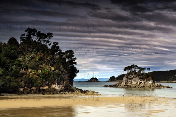 Dramatic clouds over a picturesque beach scene in Torrent Bay, zero
