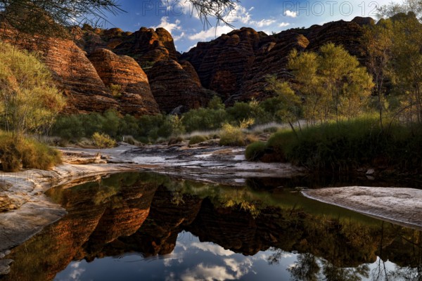 Fascinating rock formations in Purnululu NP reflected in a silent waterhole, Purnululu National Park, Western Australia, Australia