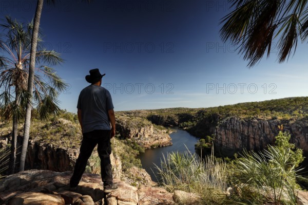 Person standing at a lookout overlooking the river and rocky landscape at Pat's Lookout, Katherine Gorge, Nitmiluk National Park, Australian Northern Territory