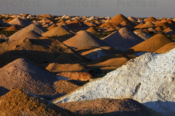 View of tailings from the opal mine in Coober Pedy under a cloudless sky, Coober Pedy, South Australia, Australia
