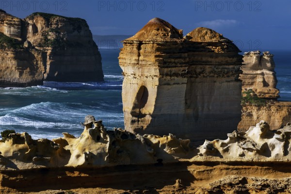 Massive rock formations of the Razorback off the stormy coast, Great Ocean Road, Victoria, Australia