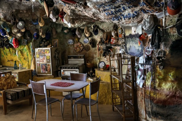 Quiet dining area in a cave filled with decorations in Coober Pedy, Coober Pedy, South Australia, Australia