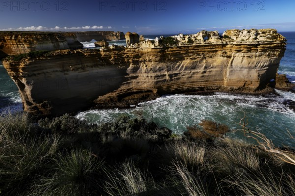 The impressive rock formation The Razorback on the Great Ocean Road surrounded by waves, Great Ocean Road, Victoria, Australia