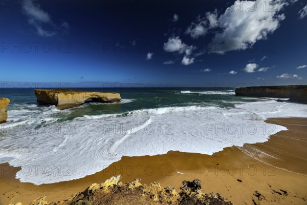 The London Bridge coastal formation on the Great Ocean Road with impressive rocks and waves, Great Ocean Road, Victoria, Australia