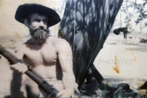 Crocodile Harry posing with hat and beard in natural setting, Coober Pedy, South Australia, Australia