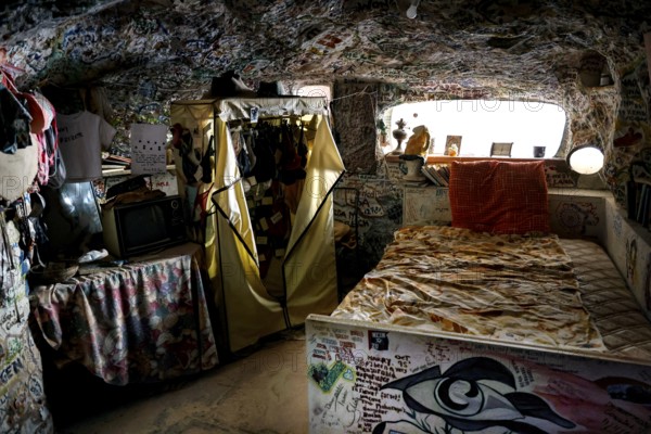 Dugout interior view with painted walls and rustic interior in Coober Pedy, Coober Pedy, South Australia, Australia