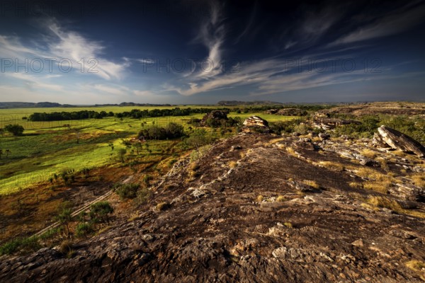 Rugged landscape under dramatic skies from Nardab Lookout in Ubirr, Kakadu National Park, Ubirr, Northern Territory, Australia