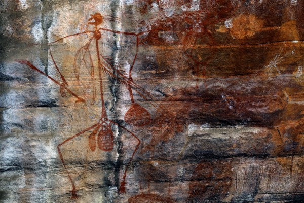 Rock painting of a stylized man on a rock in Ubirr, Ubirr, Northern Territory, Australia