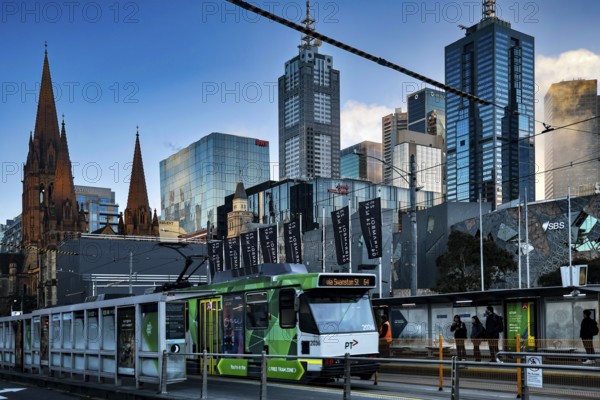 Modern skyscrapers and streetcar next to Federation Square in Melbourne, Melbourne, Victoria, Australia