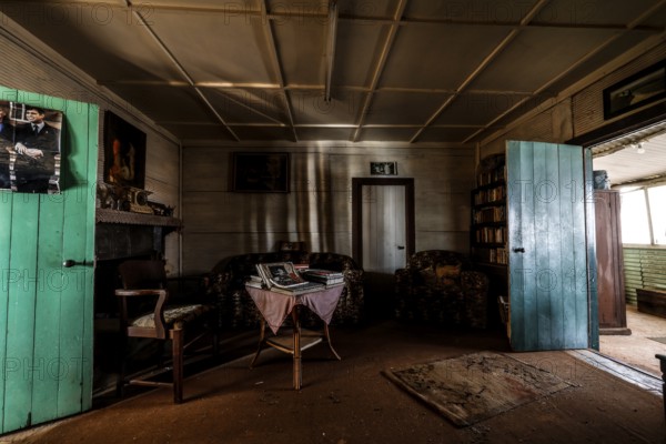 Living room with antique furniture and rustic charm, zero