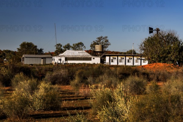 Old Andado Station building surrounded by desert vegetation in the Australian Outback, Old Andado Station, Northern Territory, Australia
