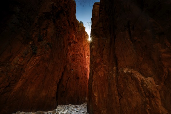 Dramatic rock formations of Standley Chasm with sunbeams shining through, Standley Chasm, Northern Territory, Australia